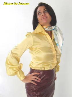 Sarah Wild looking sexy in a yellow satin 70s blouse and silk scarf