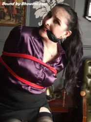 Photo of Caroline Pierce in bondage.