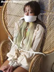 Photo of Jen Bailey in bondage.