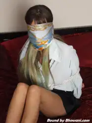 Photo of Jen Bailey in bondage.