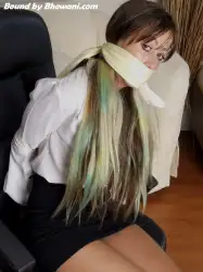 Photo of Jen Bailey in bondage.