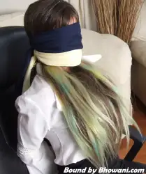 Photo of Jen Bailey in bondage.