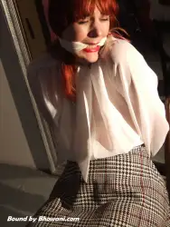 Photo of Kitty Quinzell in bondage.