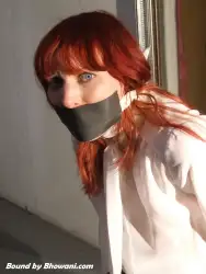 Photo of Kitty Quinzell in bondage.