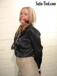Photo of Lucy Zara in bondage.