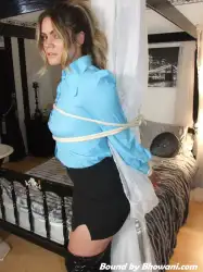 Photo of Roxi Stone in bondage.