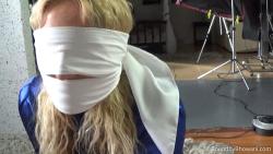 Photo of Zoey Ziptie in bondage.